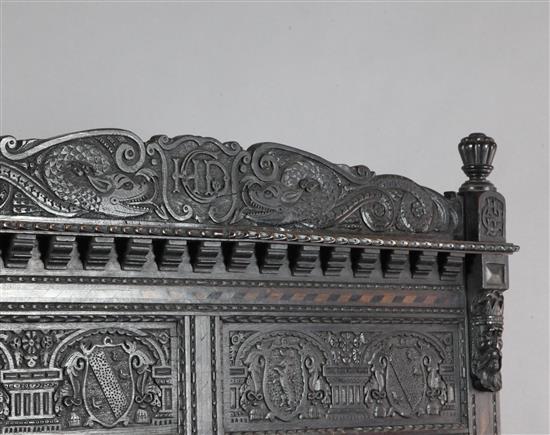 A 17th century style inlaid oak monks bench, W.4ft 4in. D.1ft 11in. H.5ft